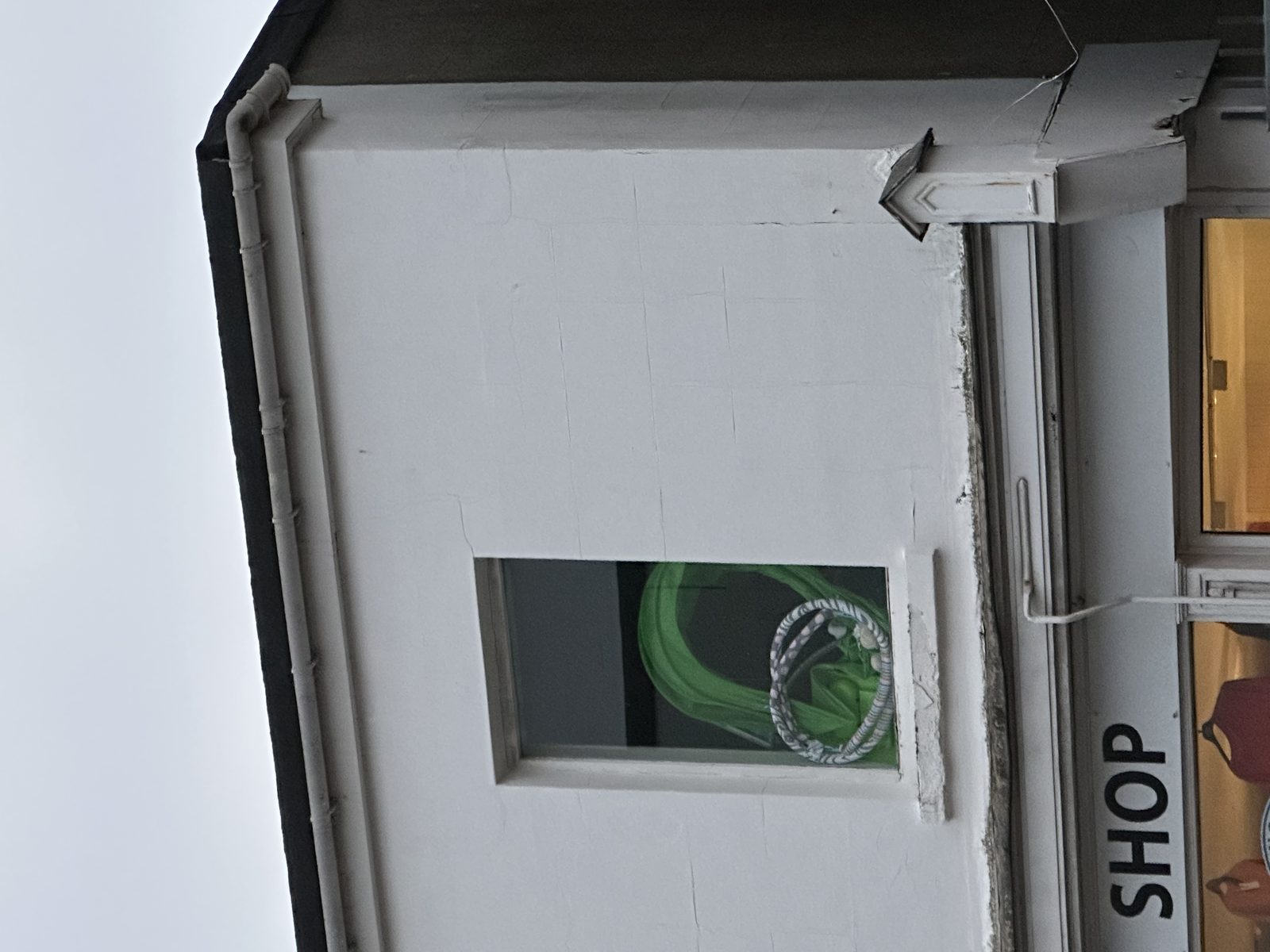 Typical condition: failed built-up (BUR) flat roof with ponding water, blistered cap sheet, and multiple patches.
