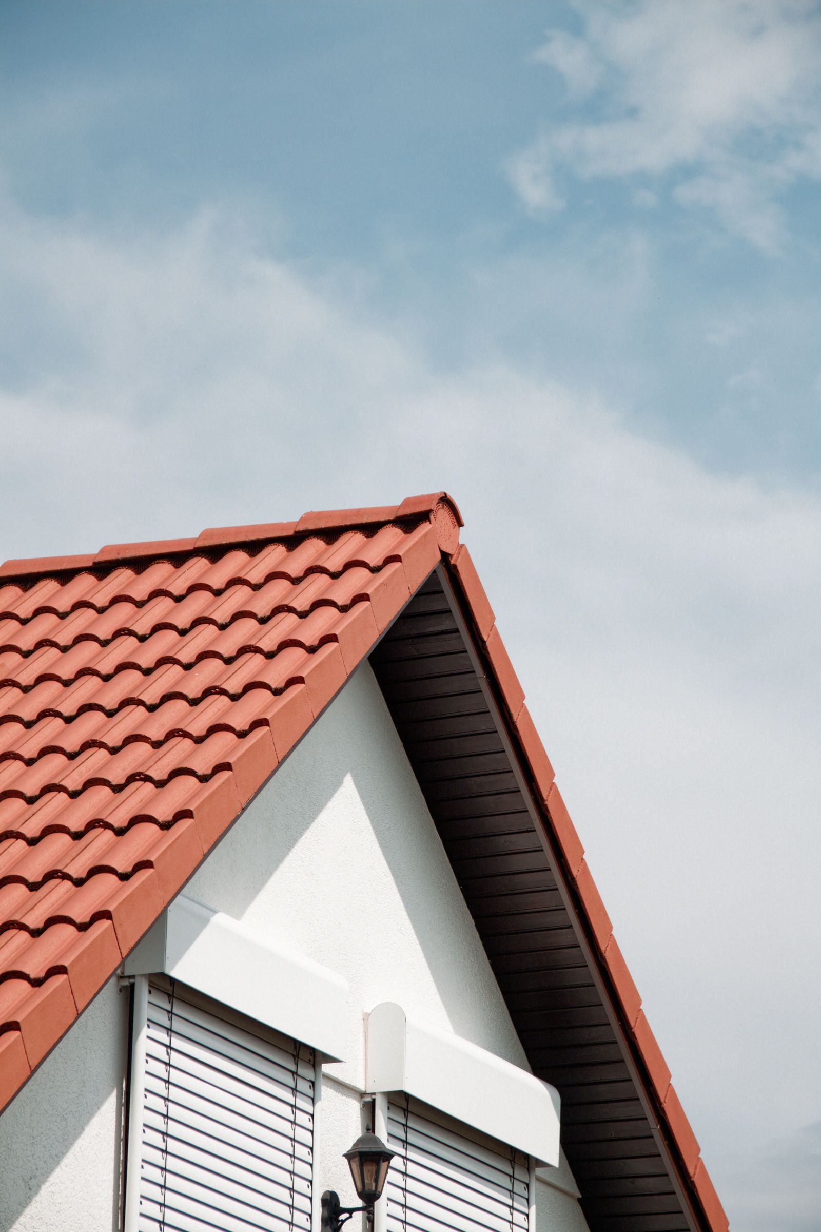 Typical repair: clean tile roof surface after flashing and tile courses are reset.