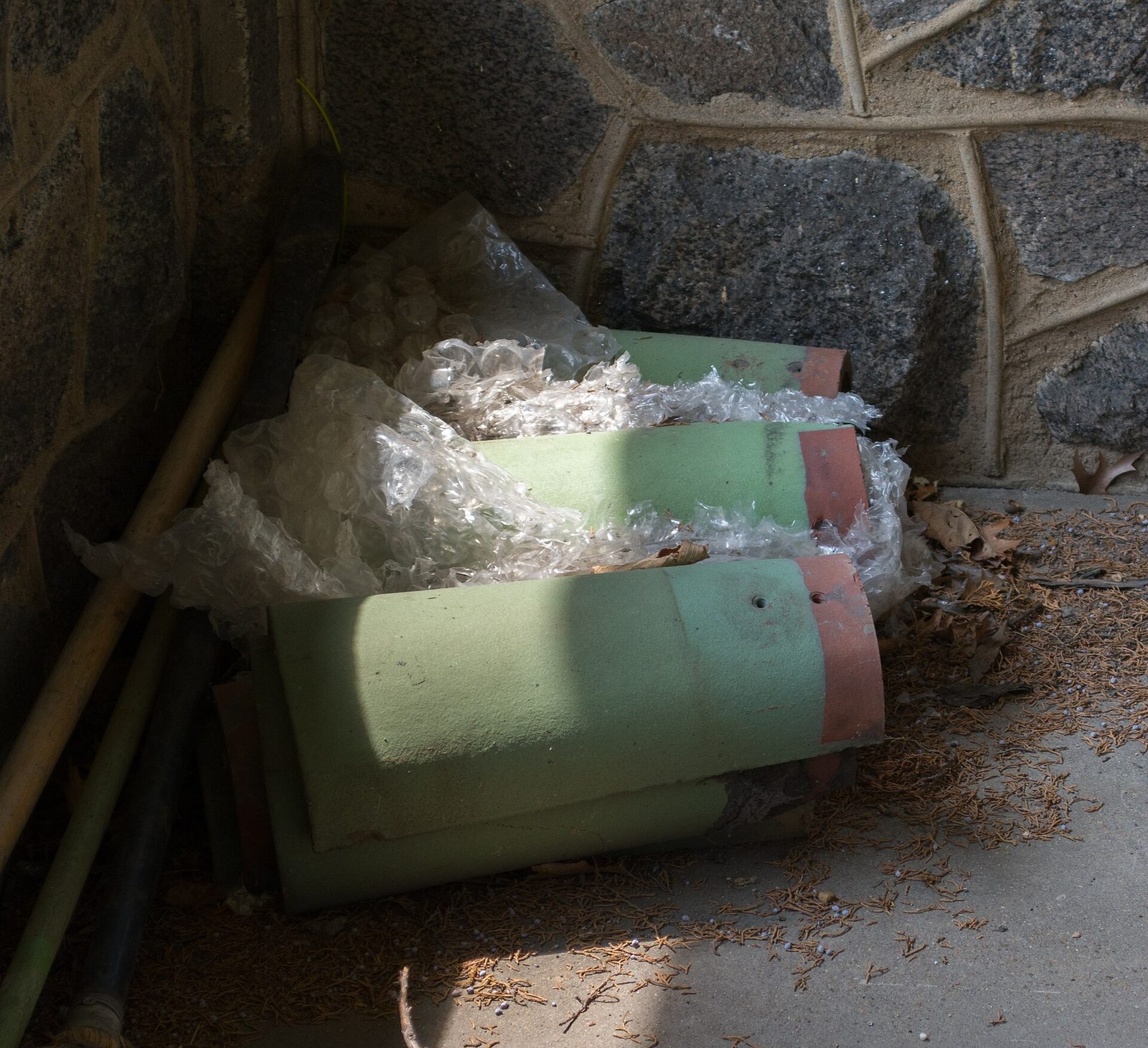 Typical condition: aging concrete S-tile roof with failed underlayment, exposed felt, and slipping tiles at the eaves.
